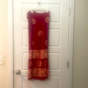 Wrap around skirt with a tie at the waist.